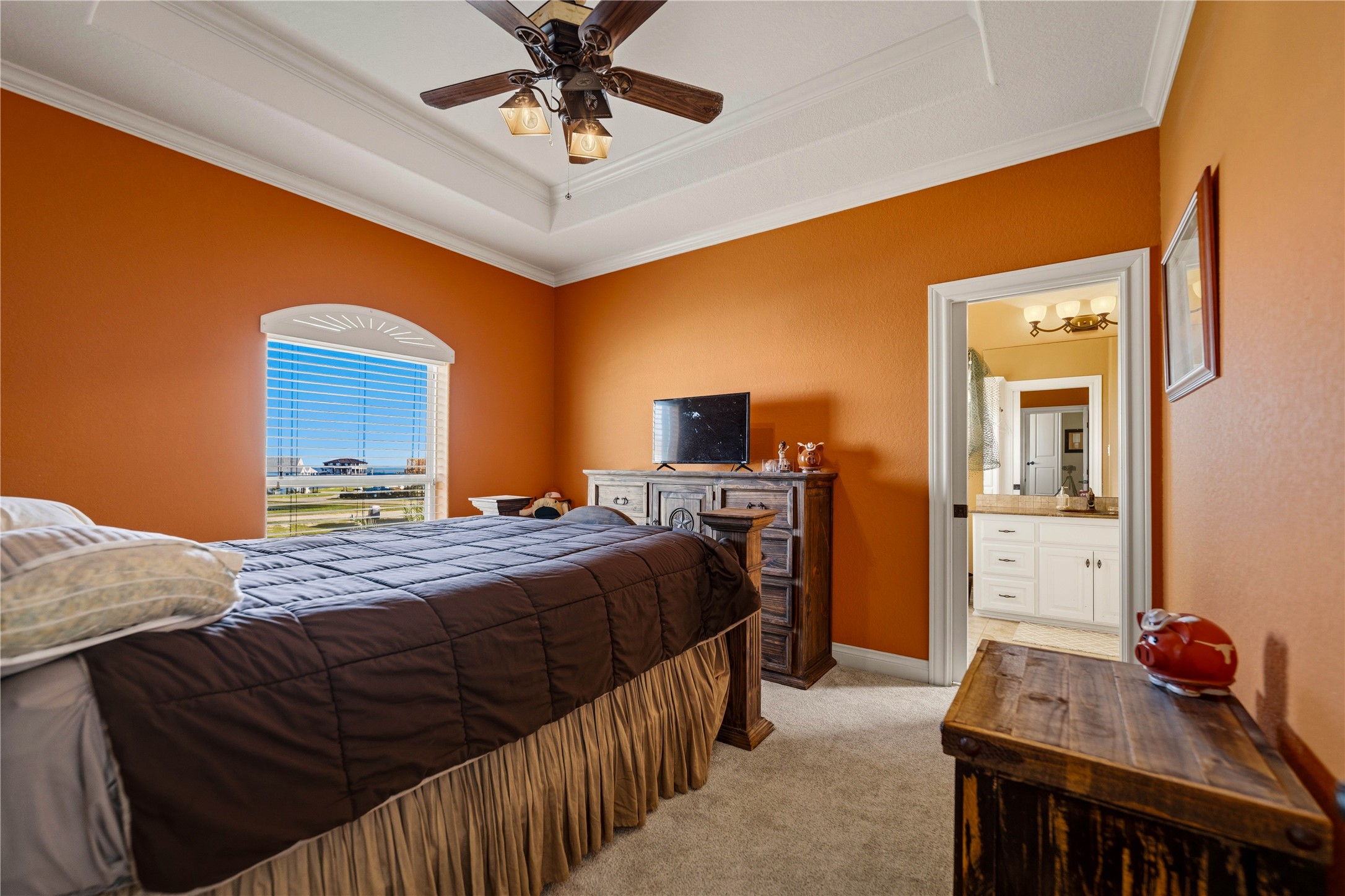 8 Loggerhead Hitchcock, TX 77563 - Photo 12 of 25 a bedroom with a bed and a chandelier