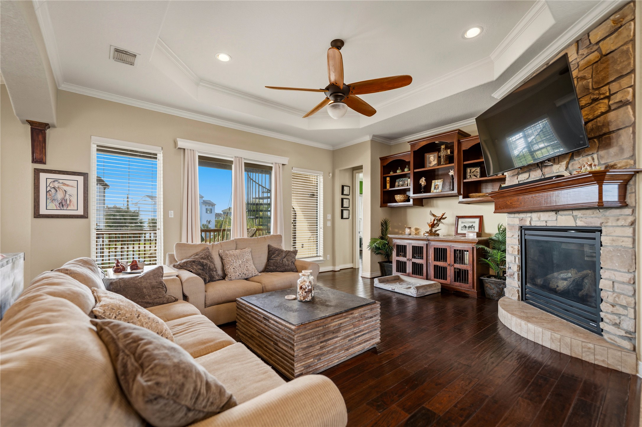 8 Loggerhead Hitchcock, TX 77563 - Photo 6 of 25 a living room with furniture a flat screen tv and a fireplace