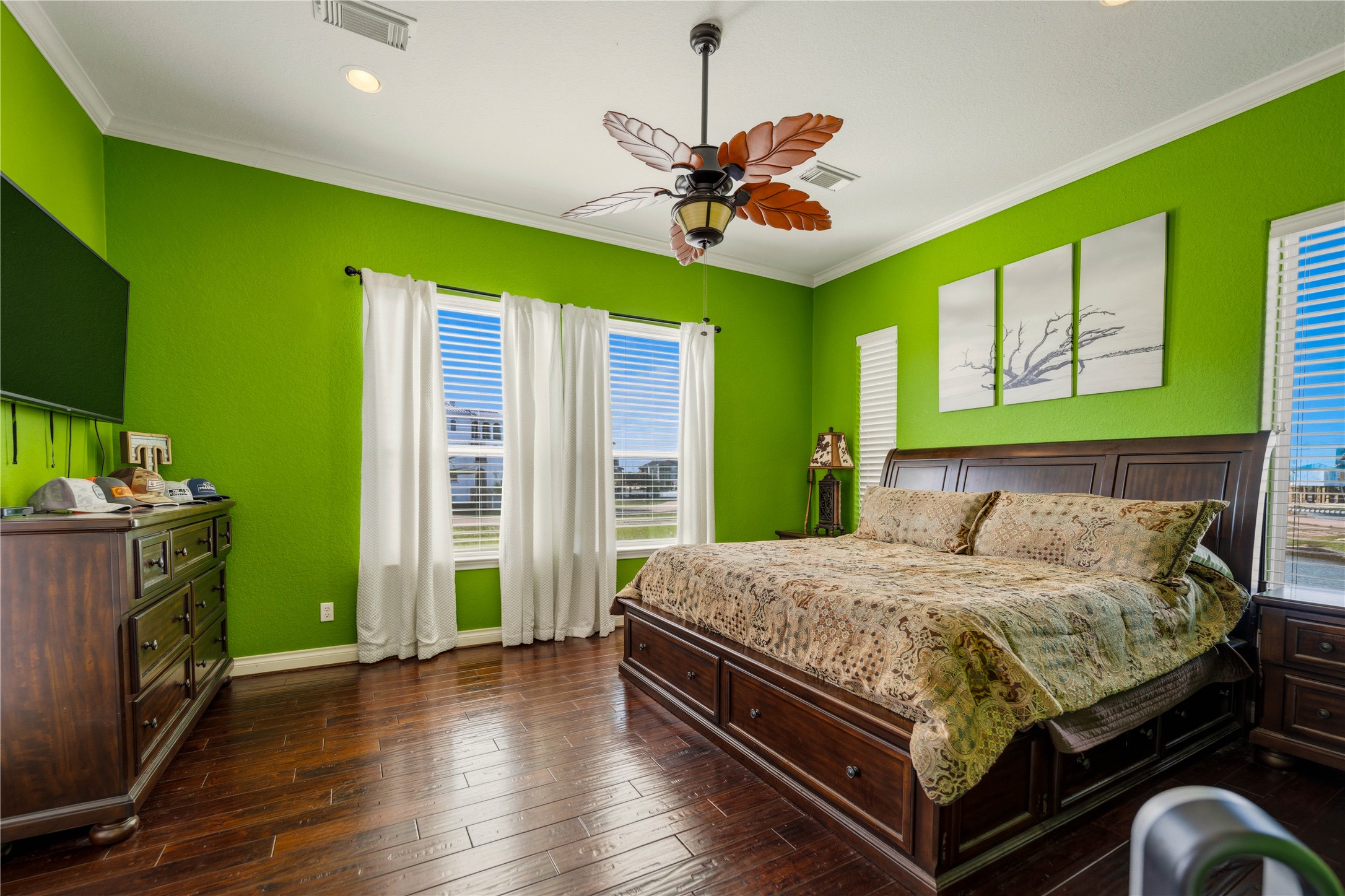 8 Loggerhead Hitchcock, TX 77563 - Photo 8 of 25 a bedroom with a bed and a chandelier