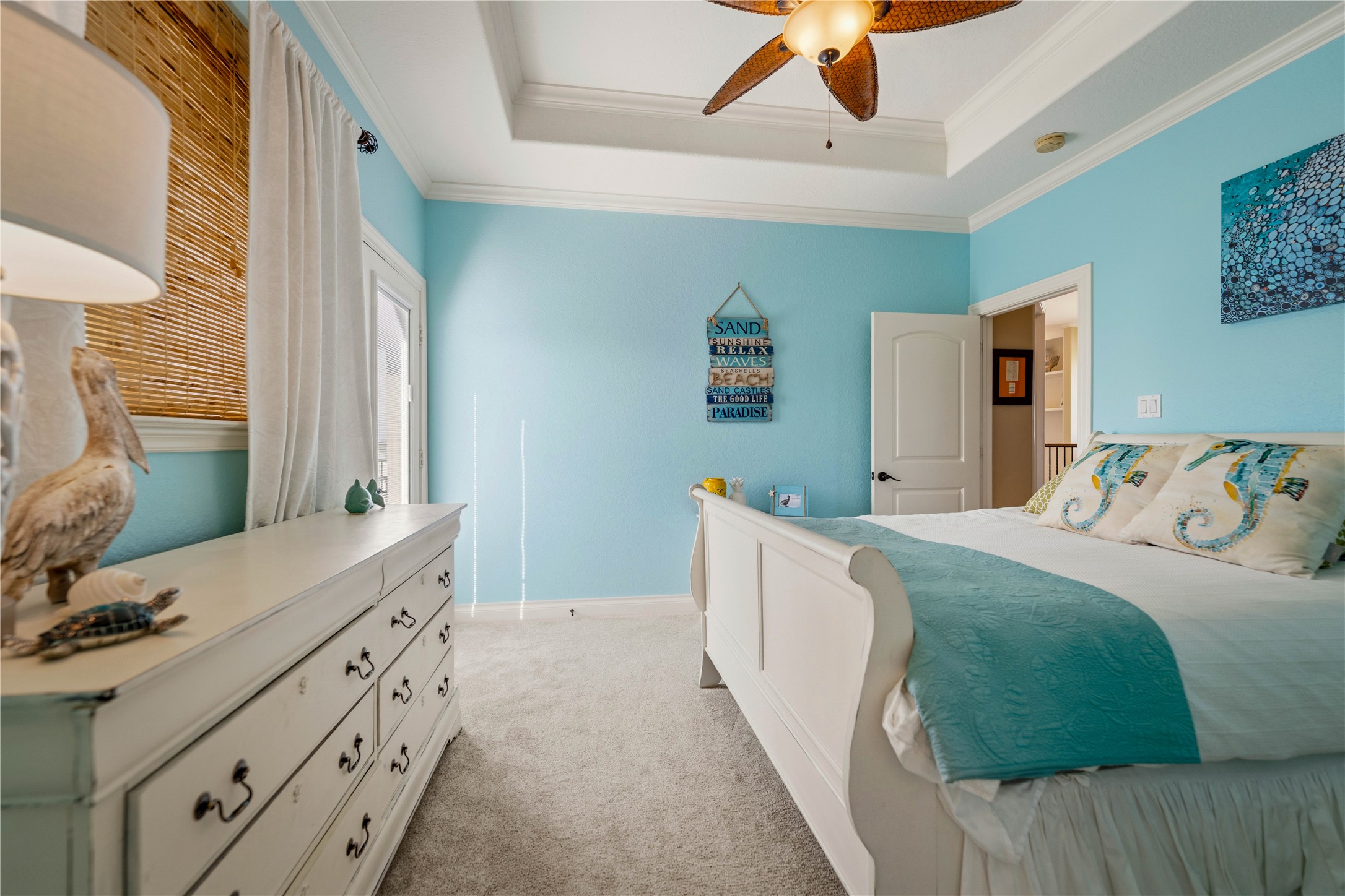 8 Loggerhead Hitchcock, TX 77563 - Photo 10 of 25 a bedroom with a bed and a chandelier