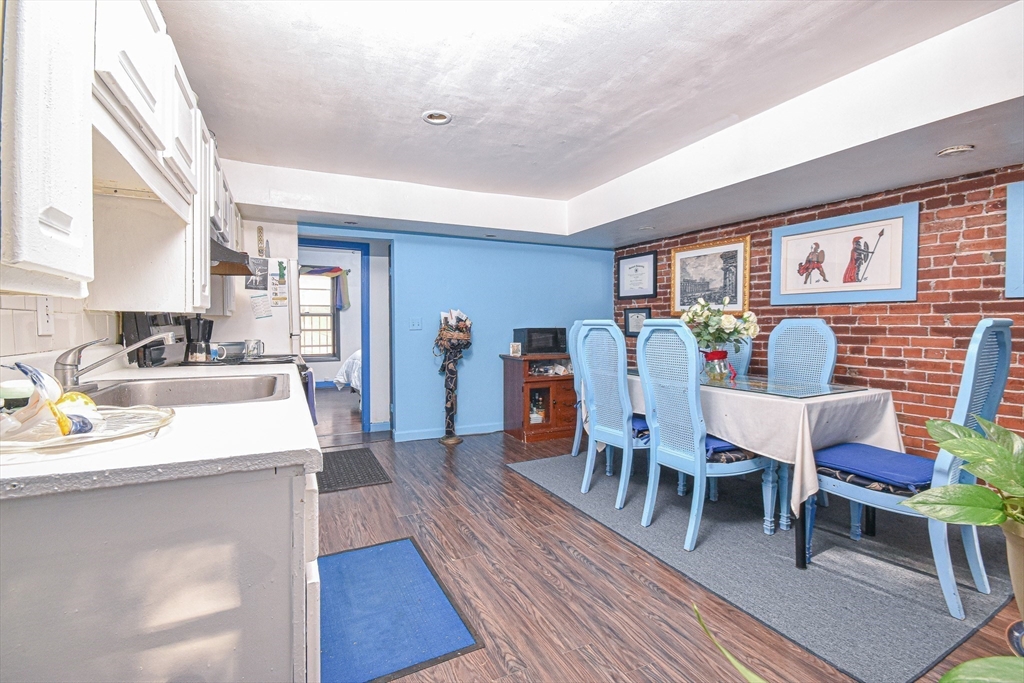61 Webster Street, Unit 3 Boston, MA 02128 - Photo 4 of 20 a dining room with furniture and wooden floor