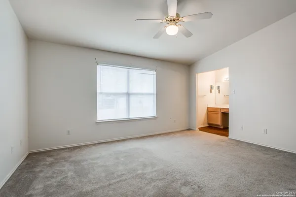 an empty room with a empty space and windows