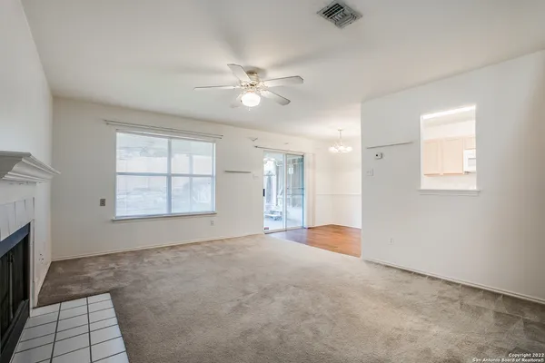 a view of an empty room with a window