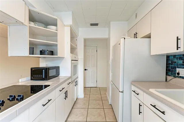 a bathroom with a shower and a sink