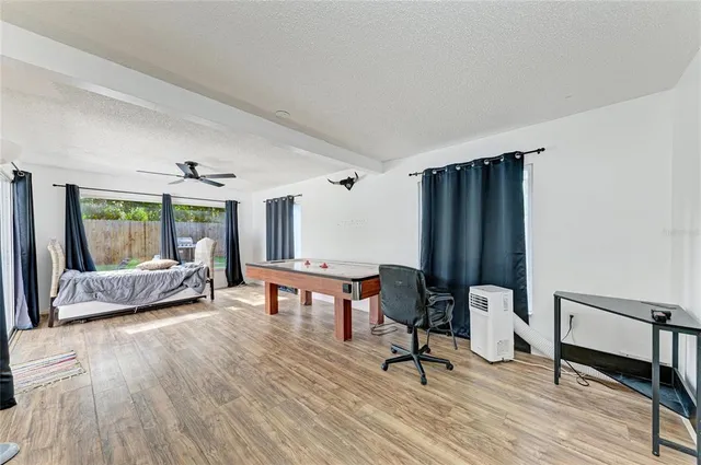 a view of a center kitchen island with furniture and a window