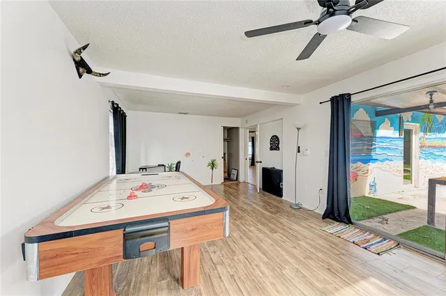 a backyard of a house with barbeque oven table and chairs