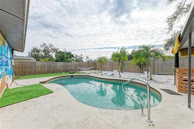 a view of a swimming pool with a patio