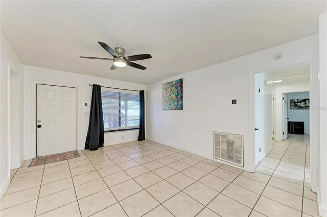 a view of an empty room with a window