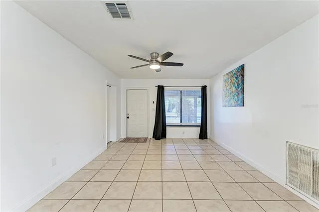 a very nice looking room with a ceiling fan