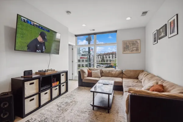 a living room with furniture and a large window
