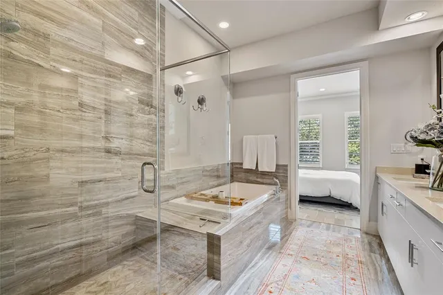 a spacious bathroom with a granite countertop sink a toilet and bathtub