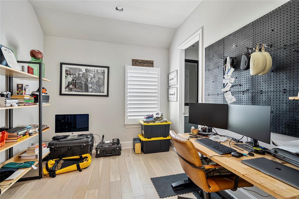 2157 Wenge Lane Dallas, TX 75219 - Photo 13 of 26 a bedroom with furniture and a window