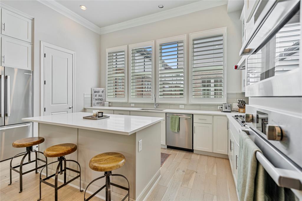 2157 Wenge Lane Dallas, TX 75219 - Photo 2 of 26 a kitchen with a sink stove and cabinets