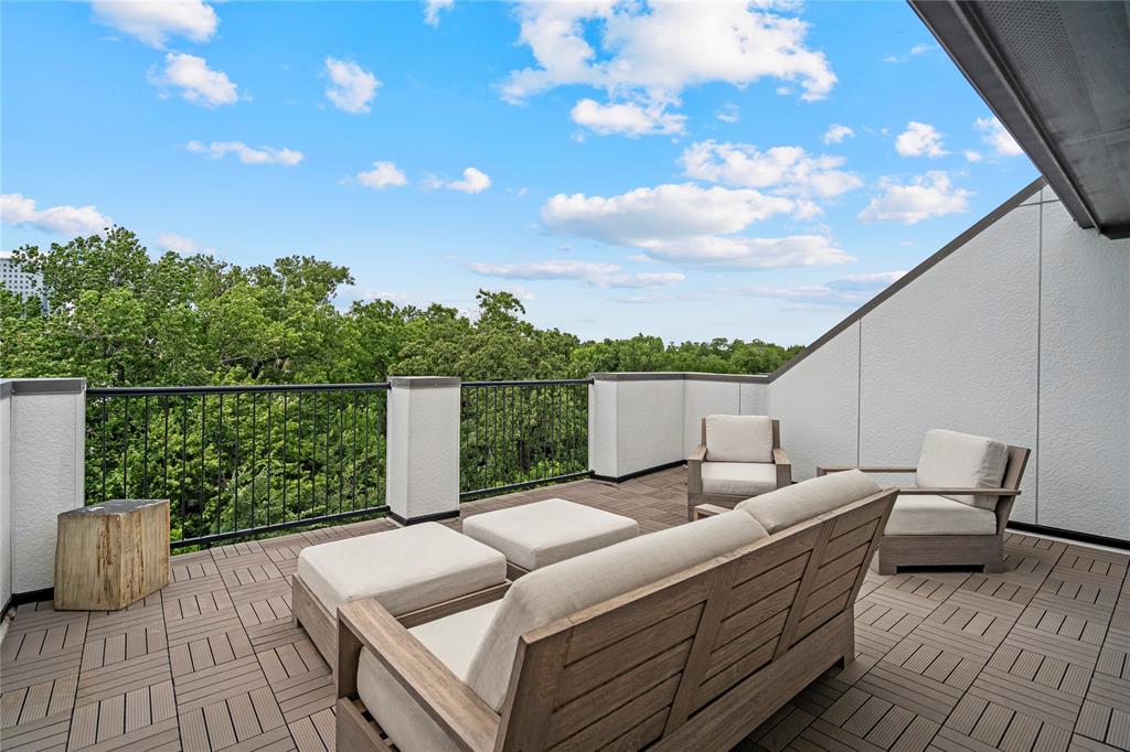 2157 Wenge Lane Dallas, TX 75219 - Photo 22 of 26 a terrace of a house with wooden floor and outdoor seating