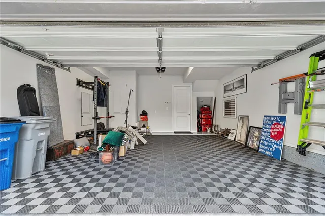 a view of a hallway with wooden floor and stairs