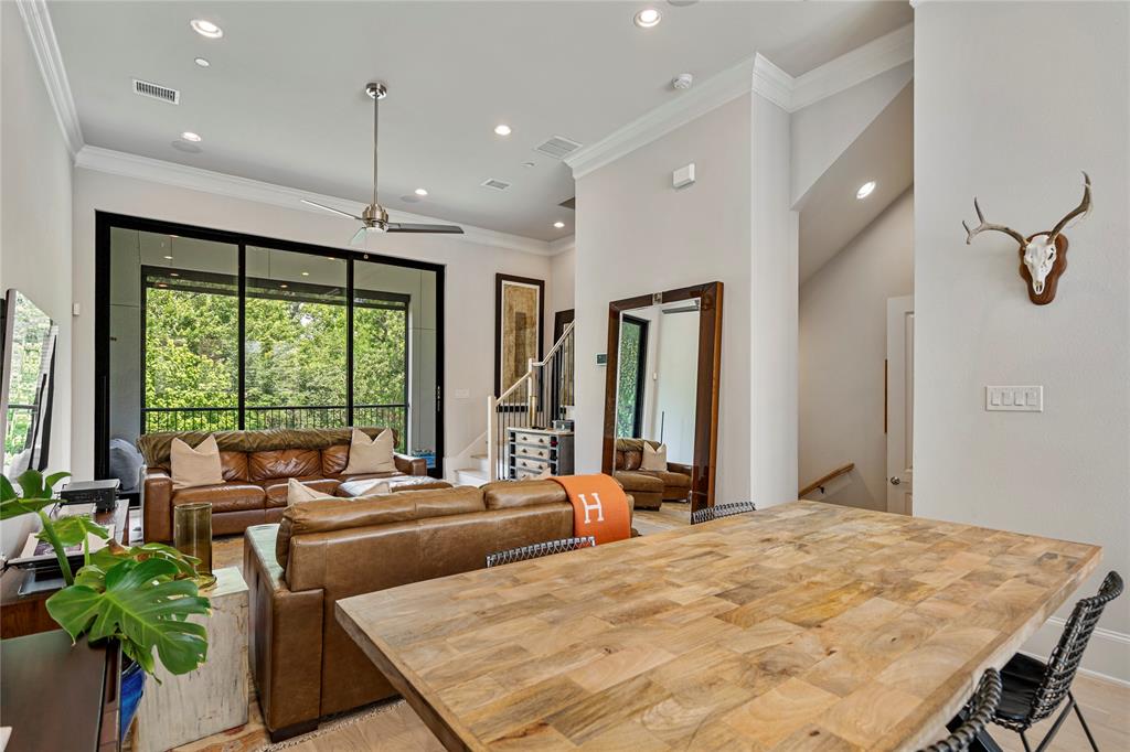 2157 Wenge Lane Dallas, TX 75219 - Photo 5 of 26 a bedroom with a large bed and a potted plant