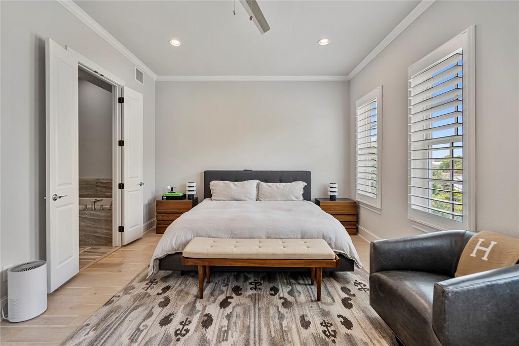 2157 Wenge Lane Dallas, TX 75219 - Photo 10 of 26 a bed room with a bed and a couch