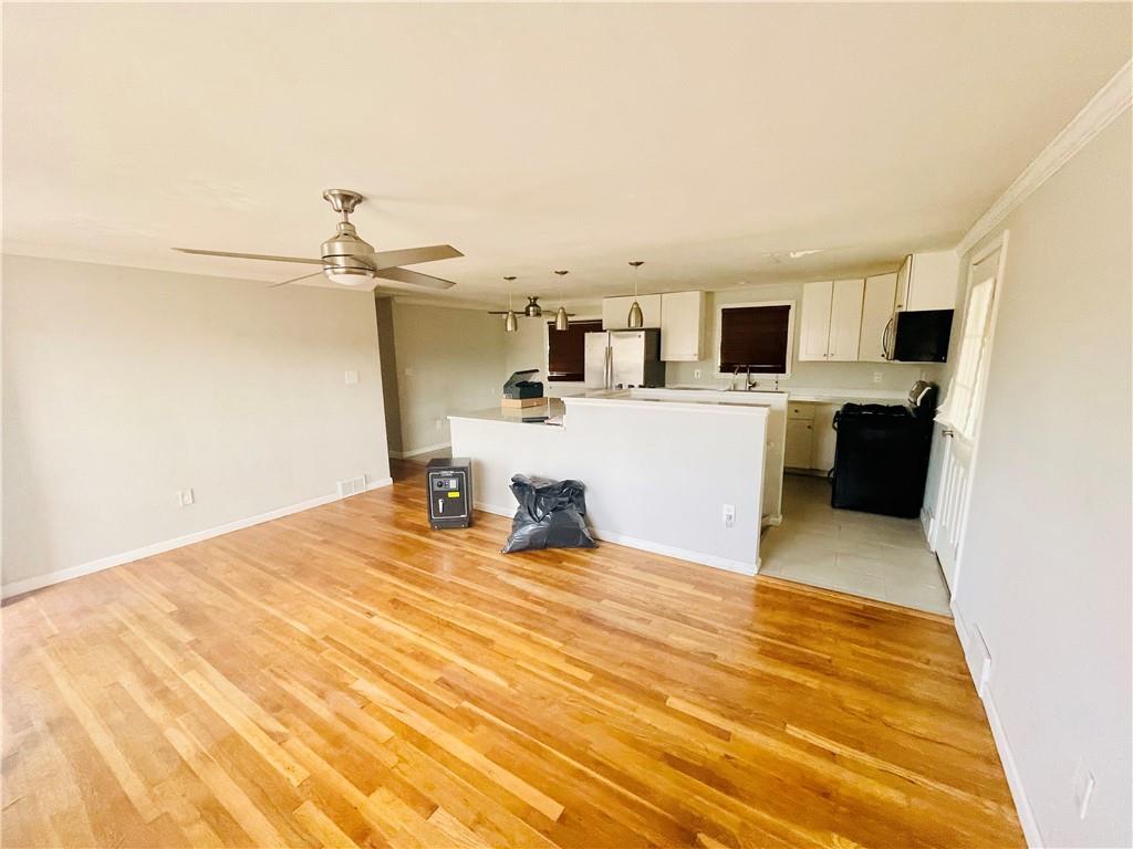 2720 Mt Troy Road Pittsburgh, PA 15212 - Photo 12 of 15 a bedroom with a bed and flat screen tv