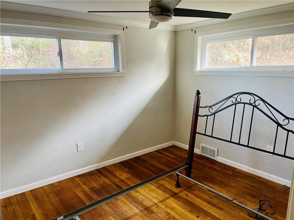 2720 Mt Troy Road Pittsburgh, PA 15212 - Photo 4 of 15 a view of a hallway with wooden floor