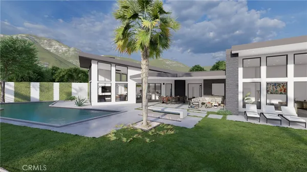 a view of a house with backyard sitting area and garden