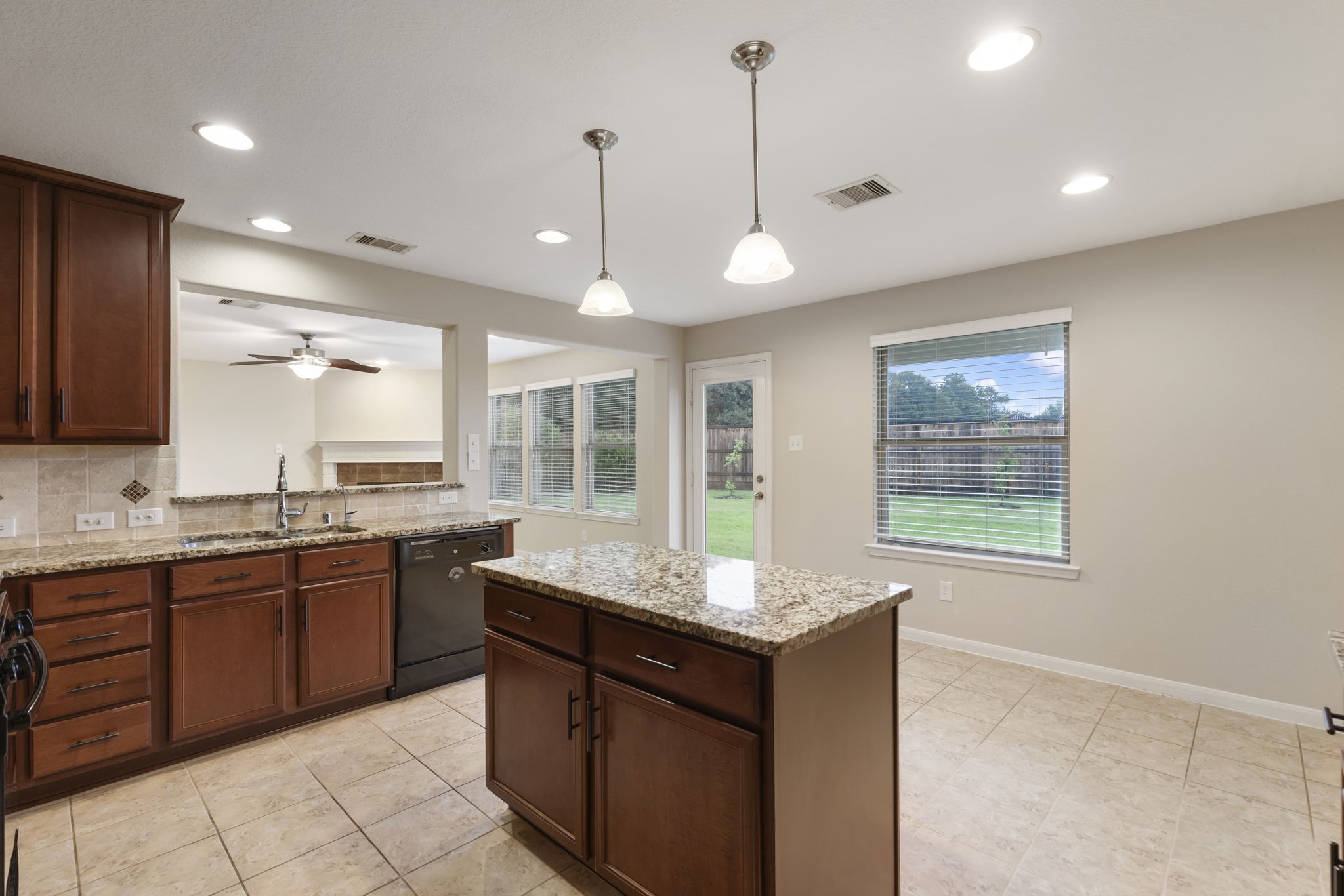 7130 Edwanna Lane Spring, TX 77389 - Photo 10 of 36 The kitchen also features tile flooring, tons of recessed lighting, and large windows overlooking the great backyard.
