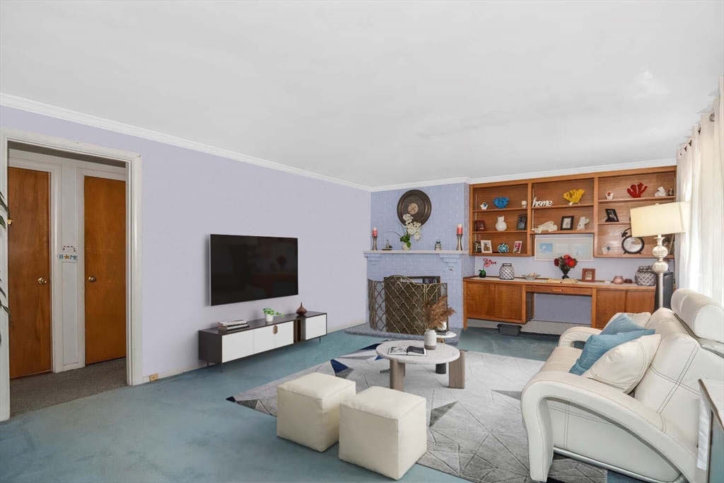 9 Flagg Drive Framingham, MA 01702 - Photo 1 of 22 a living room with furniture and a flat screen tv
