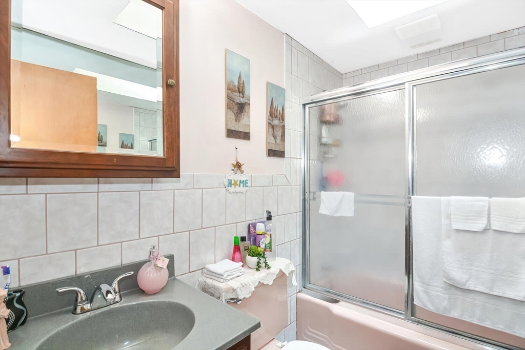 9 Flagg Drive Framingham, MA 01702 - Photo 13 of 22 a bathroom with a sink and a mirror