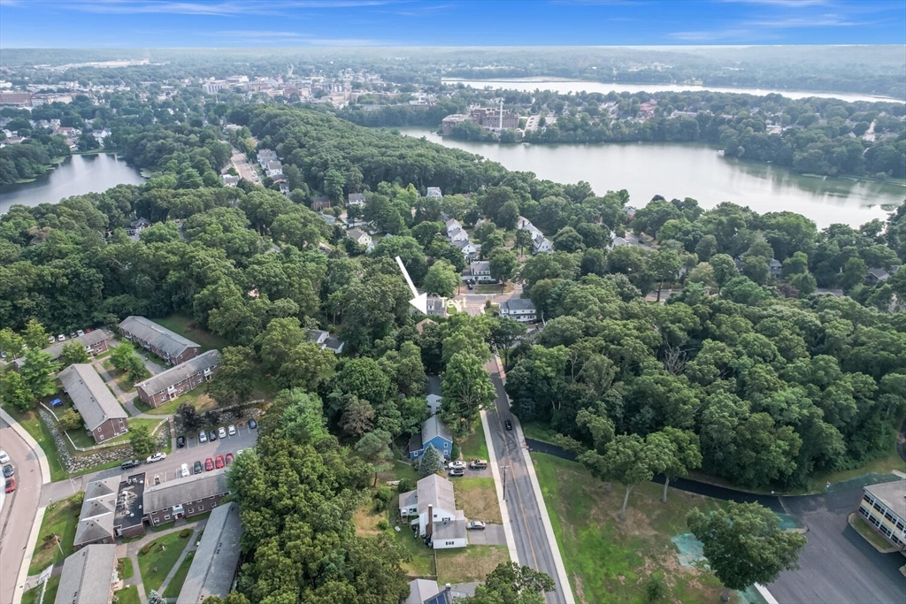 9 Flagg Drive Framingham, MA 01702 - Photo 19 of 22 an aerial view of green landscape with trees houses and lake view