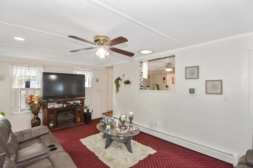 9 Flagg Drive Framingham, MA 01702 - Photo 6 of 22 a living room with furniture and a flat screen tv