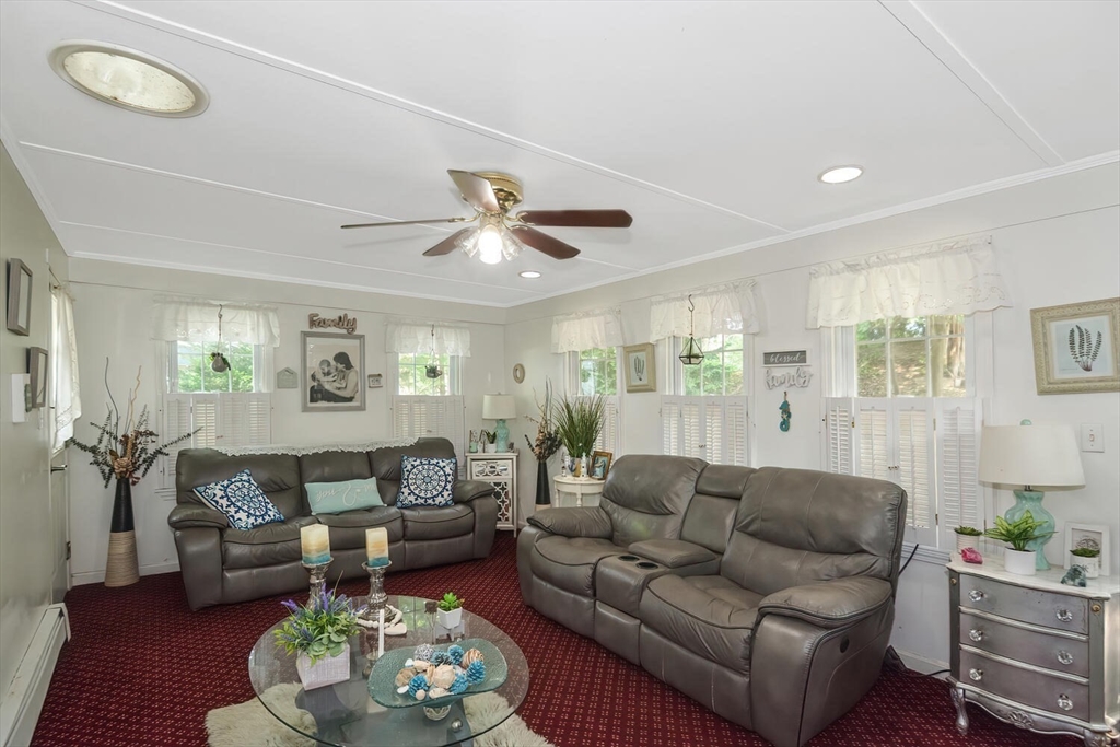 9 Flagg Drive Framingham, MA 01702 - Photo 7 of 22 a living room with furniture and a large window