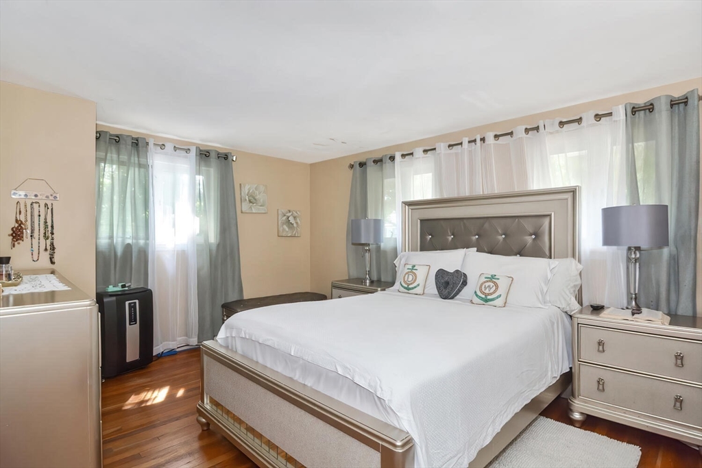 9 Flagg Drive Framingham, MA 01702 - Photo 10 of 22 a bedroom with a large bed and a window