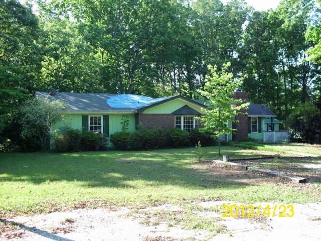 25 Dogwood Terrace Covington, GA 30016 - Photo 1 of 1 a front view of a house with a yard
