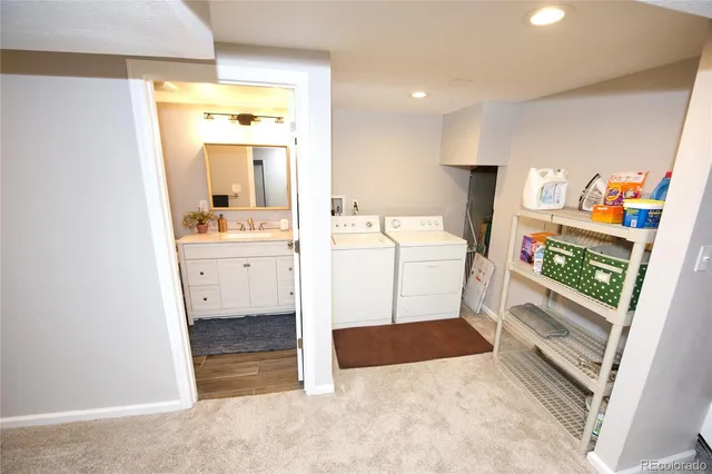 a view of storage and utility room with washer and dryer