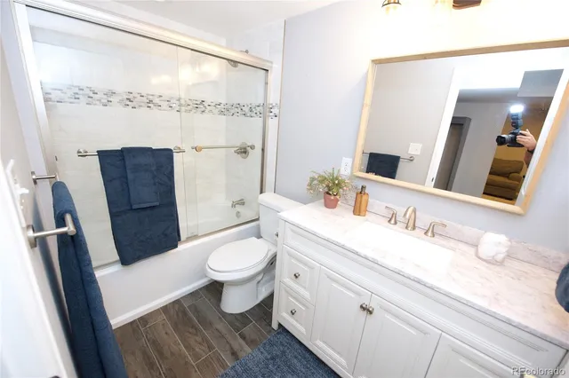 a bedroom with a bed and a lamp