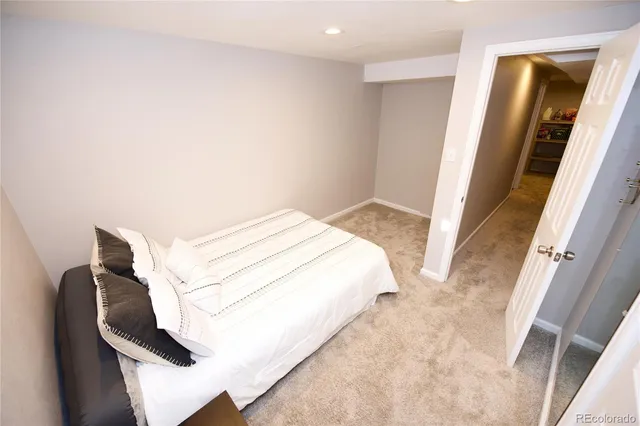 a view of a house with a big yard and potted plants