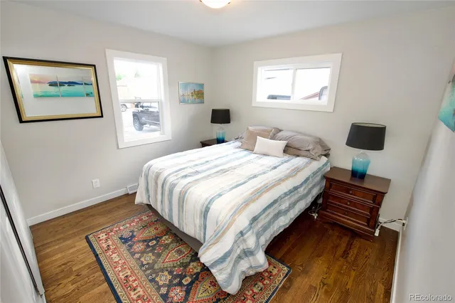 a bedroom with bed and a window