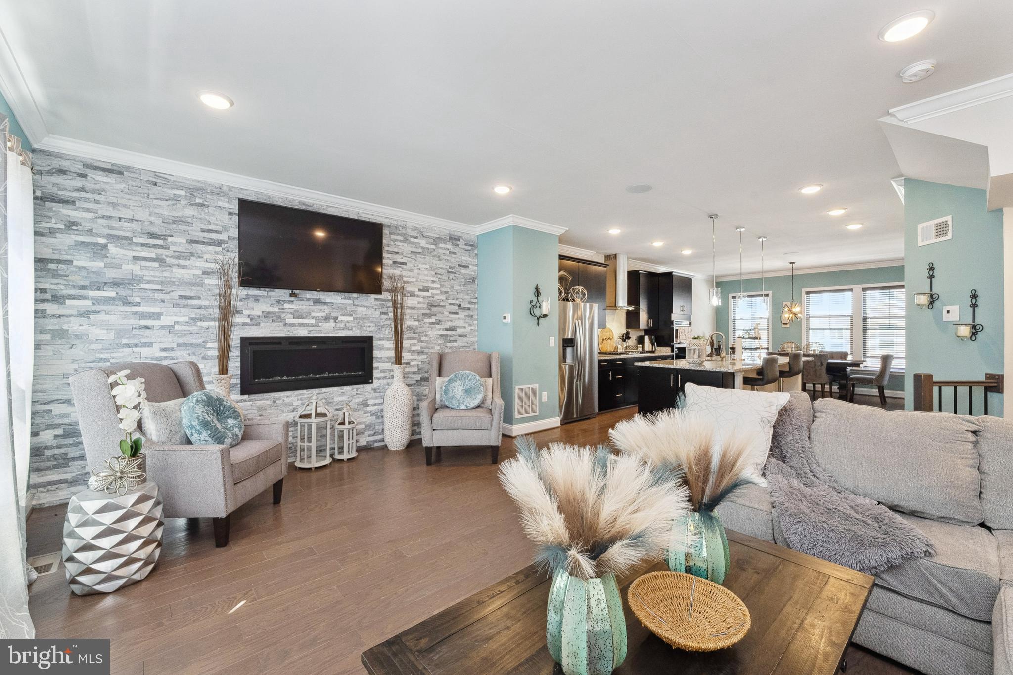 1925 Greenbriar Hall Road Dumfries, VA 22026 - Photo 11 of 63 a living room with furniture fireplace and a flat screen tv