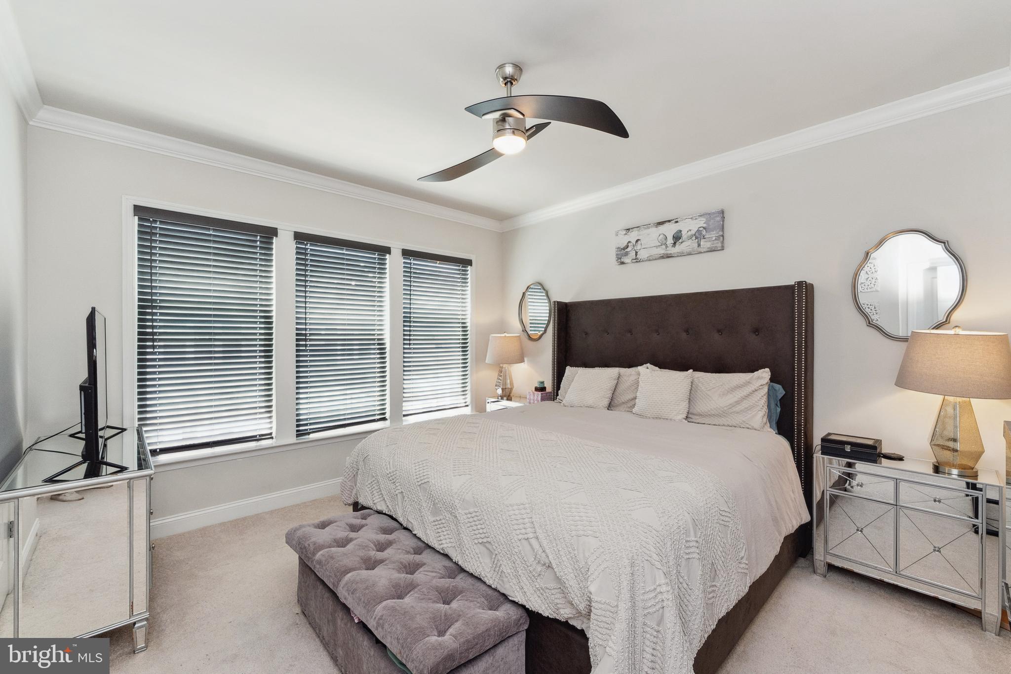 1925 Greenbriar Hall Road Dumfries, VA 22026 - Photo 19 of 63 a bedroom with a large bed and a chandelier