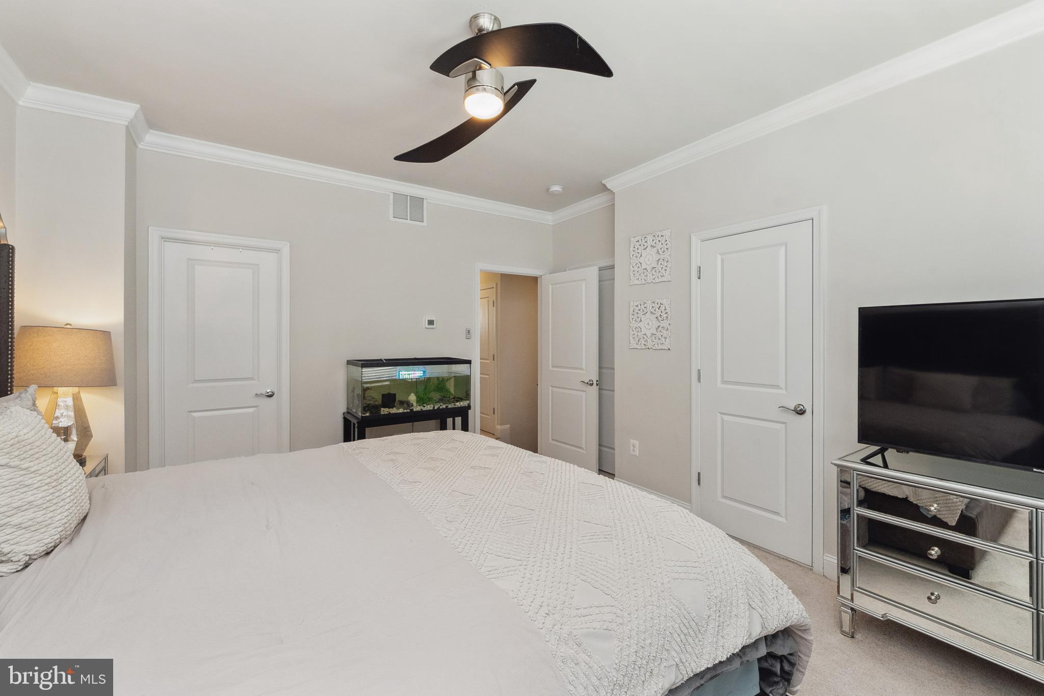 1925 Greenbriar Hall Road Dumfries, VA 22026 - Photo 20 of 63 a bedroom with a large bed and a flat tv screen