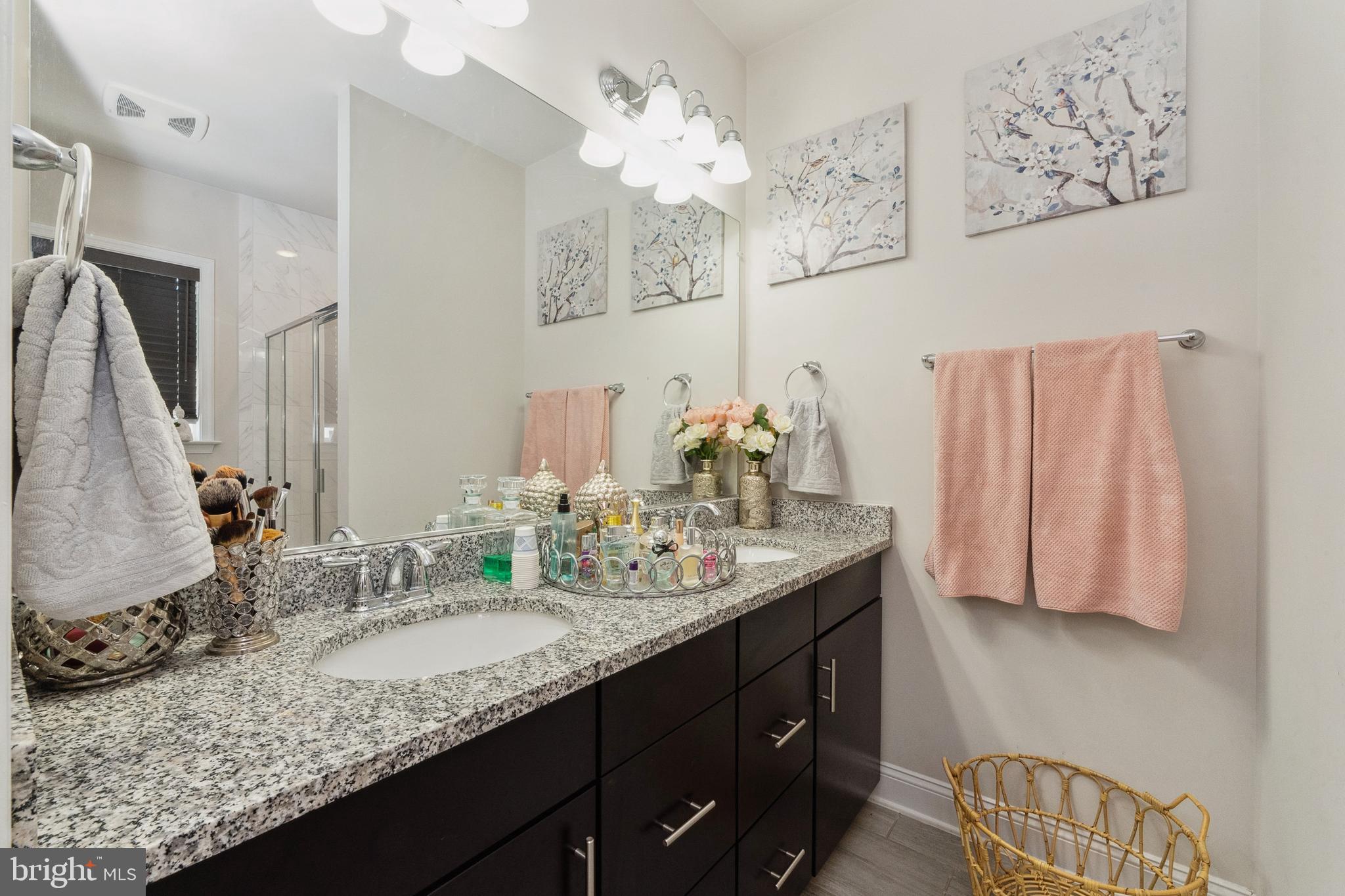 1925 Greenbriar Hall Road Dumfries, VA 22026 - Photo 21 of 63 a bathroom with a granite countertop sink and a mirror