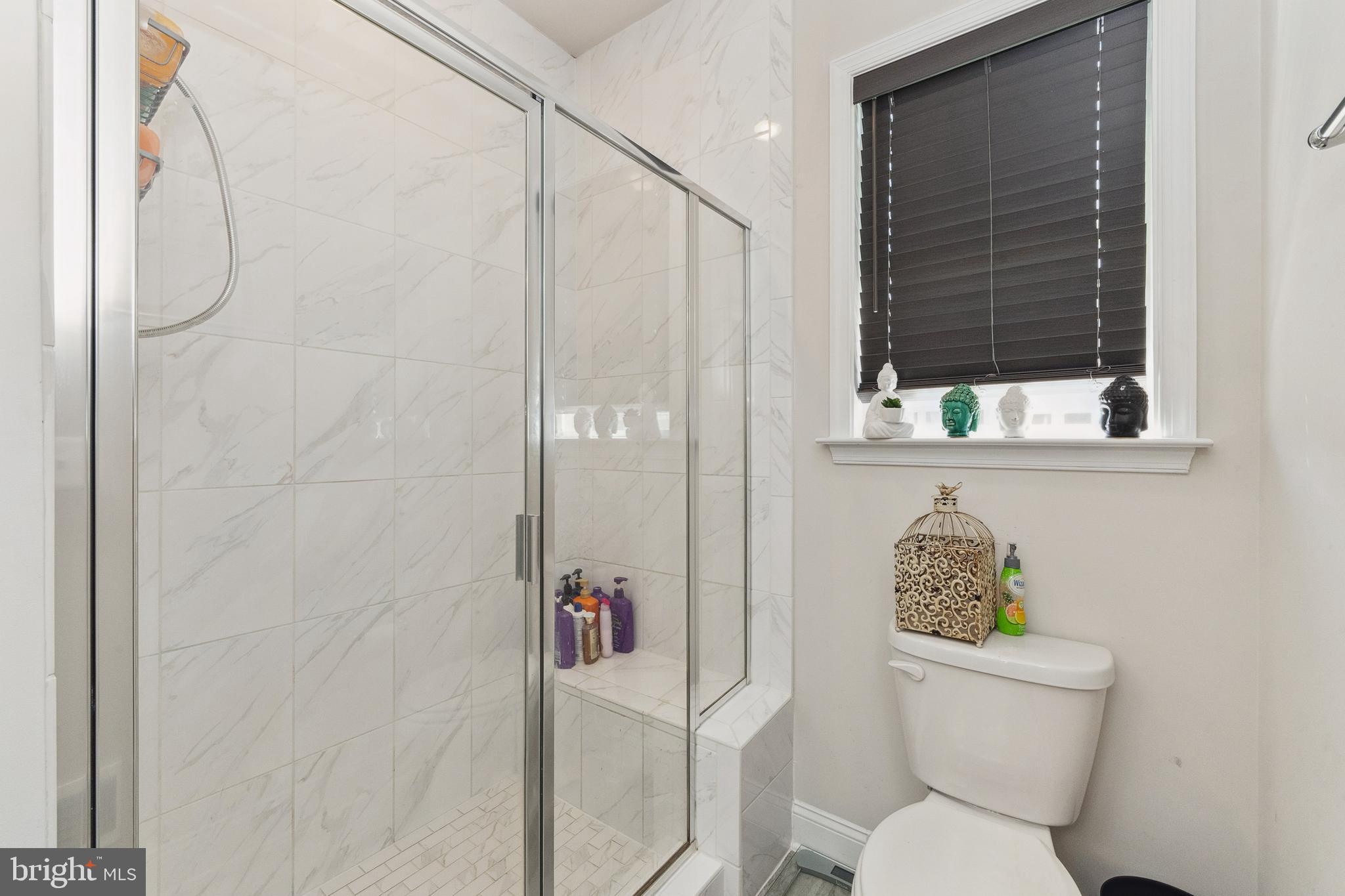 1925 Greenbriar Hall Road Dumfries, VA 22026 - Photo 22 of 63 a white toilet sitting next to a bathroom sink