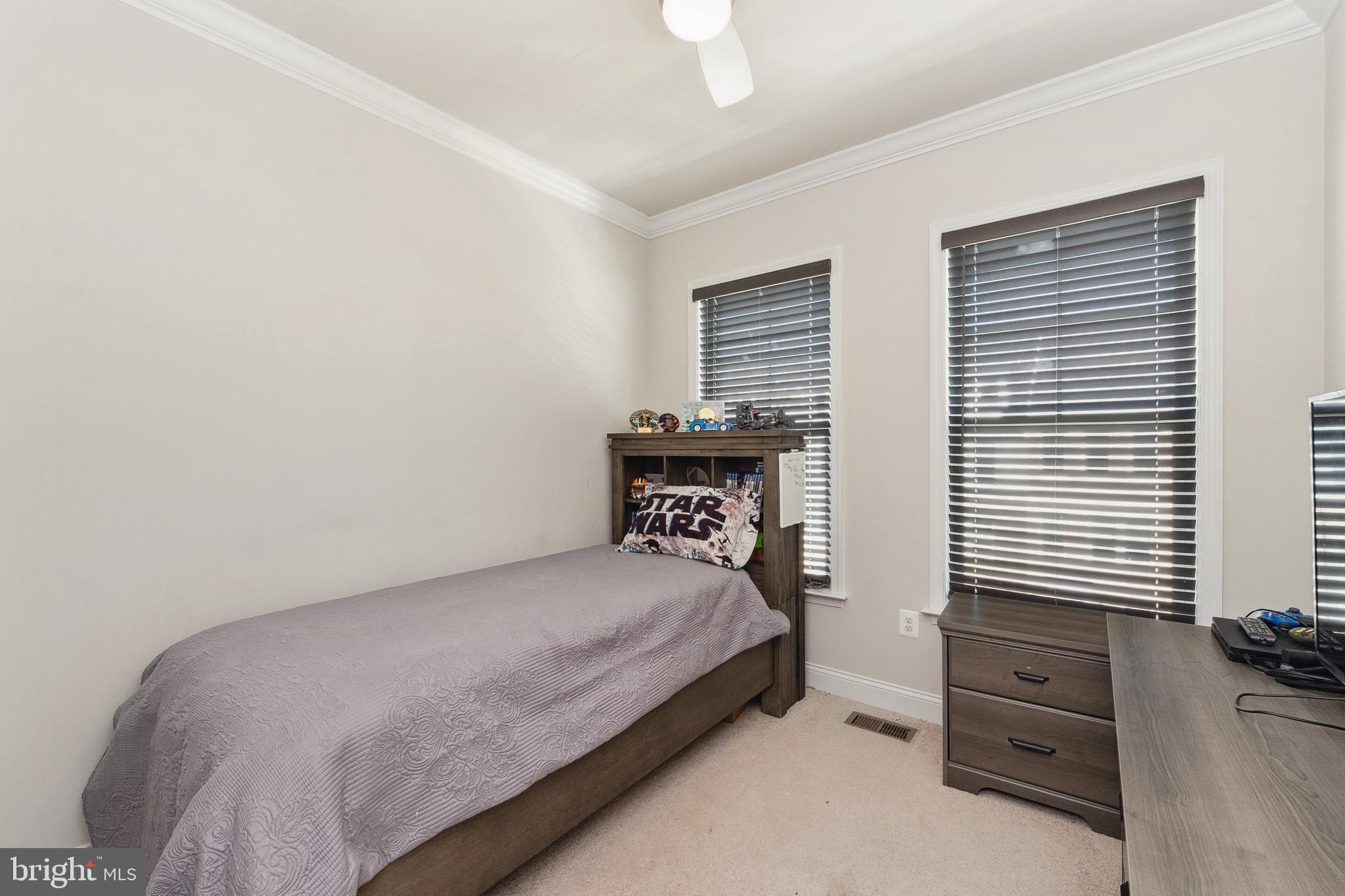 1925 Greenbriar Hall Road Dumfries, VA 22026 - Photo 25 of 63 a bedroom with a bed and a window