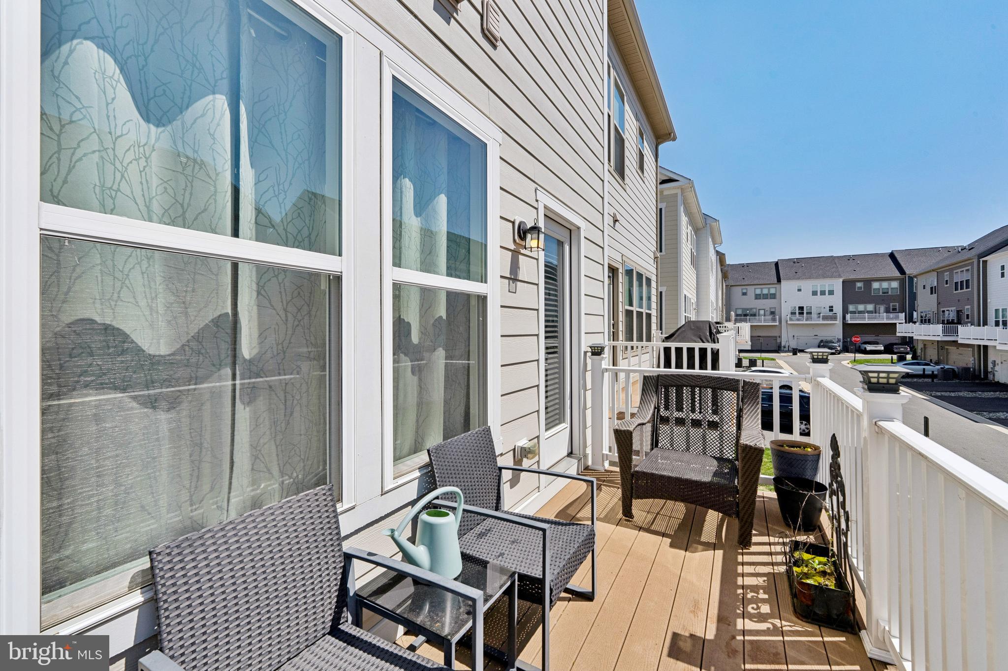 1925 Greenbriar Hall Road Dumfries, VA 22026 - Photo 29 of 63 a view of a balcony with chairs and wooden floor