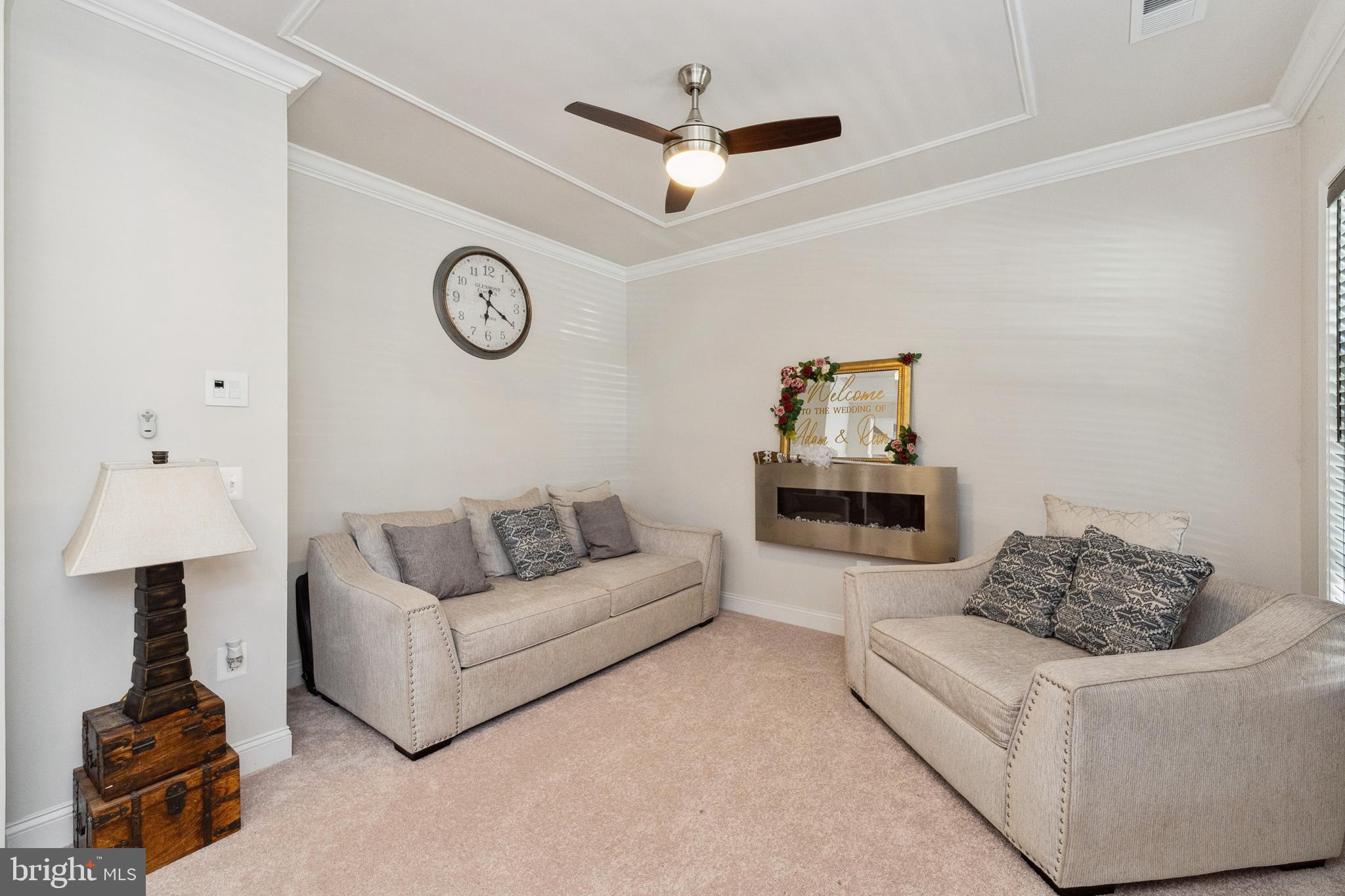 1925 Greenbriar Hall Road Dumfries, VA 22026 - Photo 5 of 63 a living room with furniture a clock and a ceiling fan