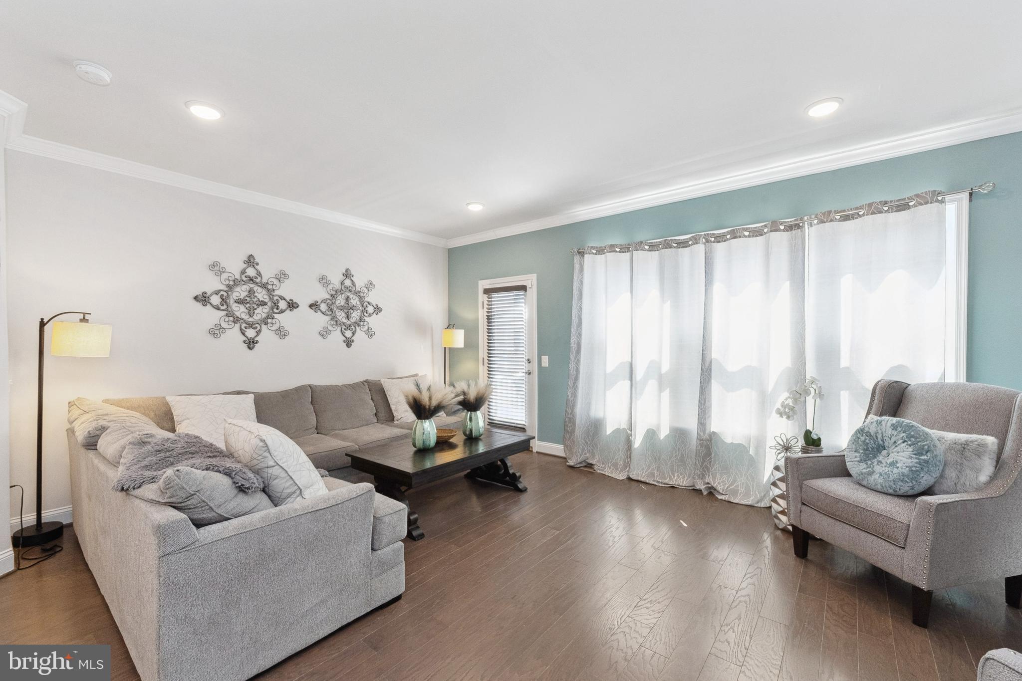 1925 Greenbriar Hall Road Dumfries, VA 22026 - Photo 9 of 63 a living room with furniture and a large window