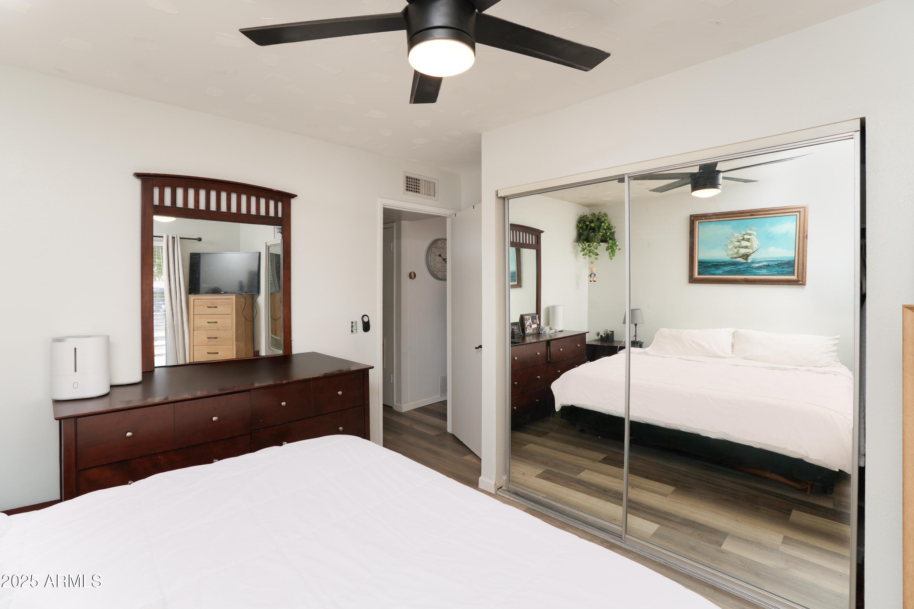 605 3rd N Street Clarkdale, AZ 86324 - Photo 15 of 37 a bedroom with a bed and a chandelier