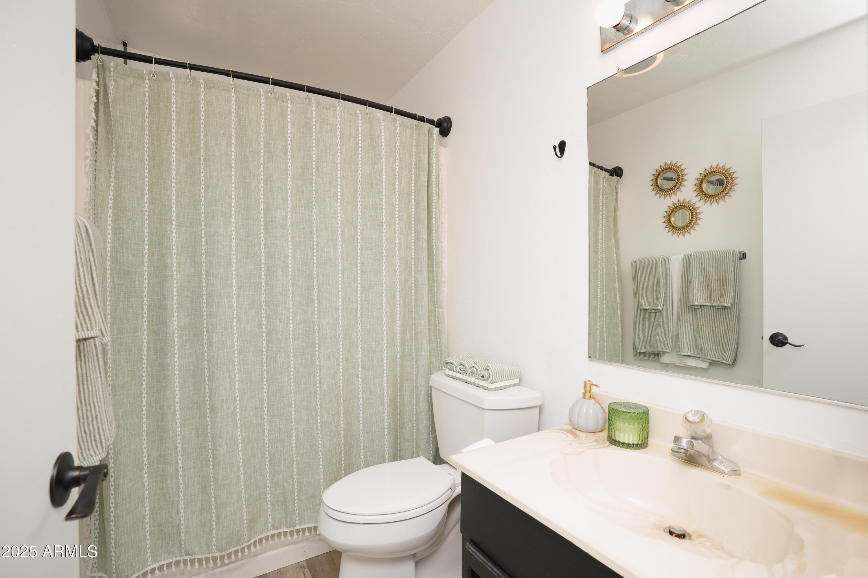 605 3rd N Street Clarkdale, AZ 86324 - Photo 17 of 37 a bathroom with a sink a toilet and shower curtain