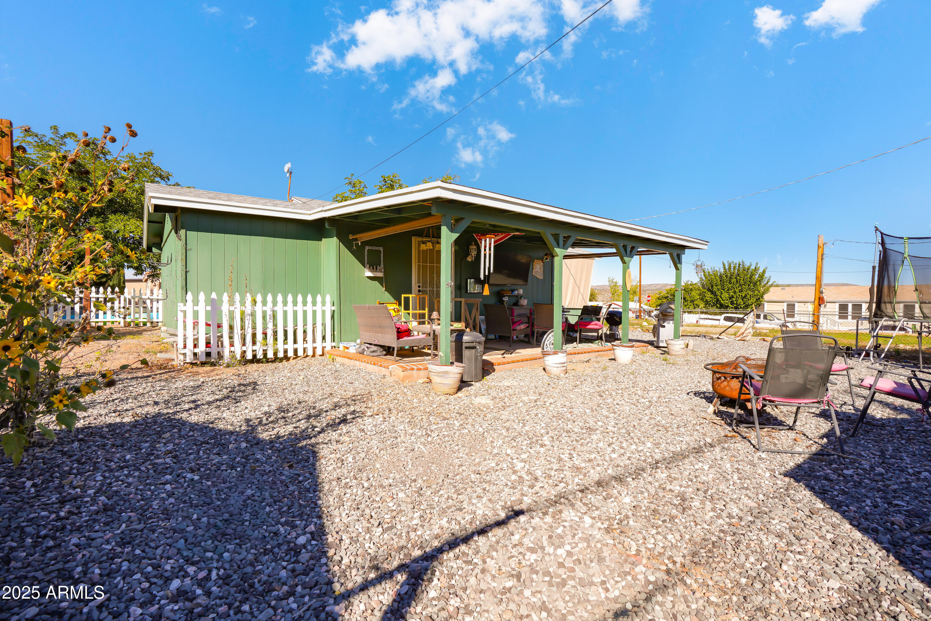 605 3rd N Street Clarkdale, AZ 86324 - Photo 22 of 37 a view of a patio with dining table and chairs with a small yard