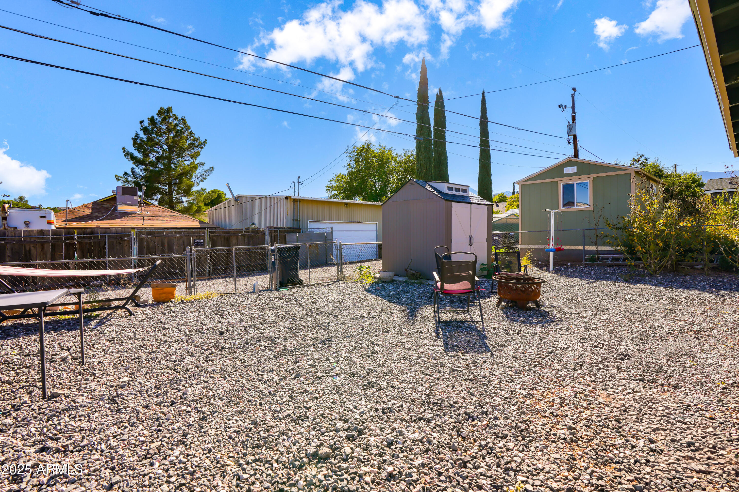 605 3rd N Street Clarkdale, AZ 86324 - Photo 24 of 37 a wooden bench sitting in the middle of a yard