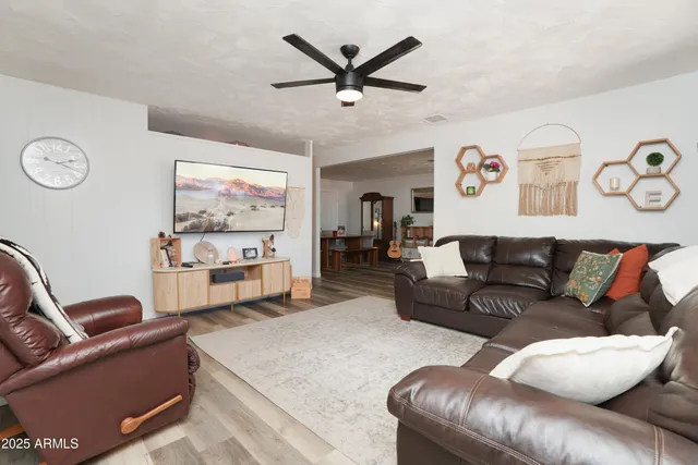 a living room with furniture and a table
